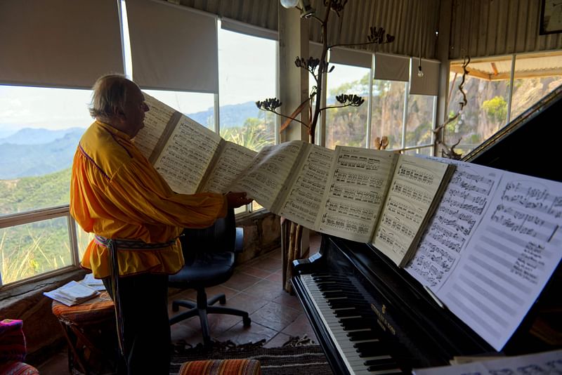 US pianist, composer, and soloist Romayne Wheeler holds sheet music at his home in the Sierra Madre Occidental in Retosachi, a ranch located in the ejido Munerachi, municipality of Batopilas, Chihuahua, Mexico, on 21 July, 2023