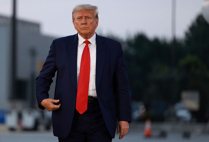 Former U.S. President Donald Trump arrives to depart at Atlanta Hartsfield-Jackson International Airport after being booked at the Fulton County jail on 24 August, 2023 in Atlanta, Georgia