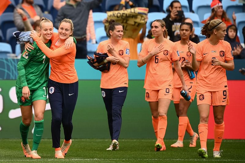 Netherlands players celebrate their victory after the end of the Australia and New Zealand 2023 Women's World Cup round of 16 football match between Netherlands and South Africa at Sydney Football Stadium in Sydney on 6 August 2023