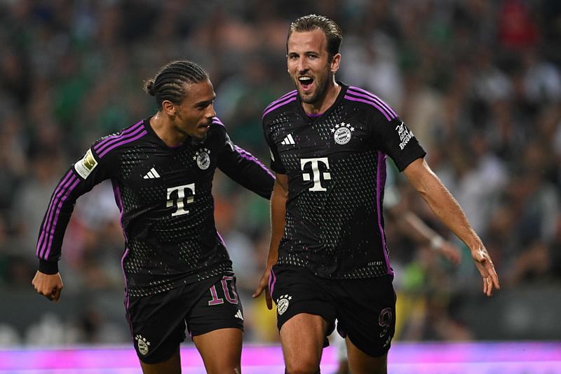 Bayern Munich's English forward Harry Kane celebrates scoring the second goal with his team-mate Bayern Munich's German midfielder Leroy Sane during the Bundesliga match between Werder Bremen and FC Bayern Munich in Bremen, Germany on 18 August 2023