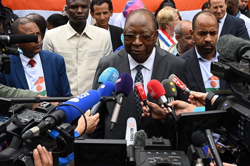 Niger Prime Minister Ouhoumoudou Mahamadou speaks to the press outside the Niger Embassy, in Paris on August 5, 2023, days after coup plotters ousted Niger's President, holding him with his family in his official Niamey residence since July 26