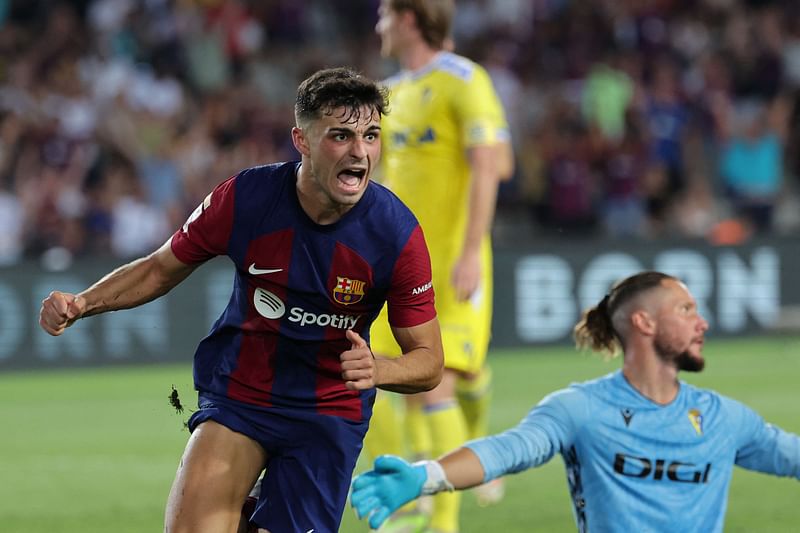 Barcelona's Spanish midfielder Pedri celebrates scoring his team's first goal during the Spanish Liga football match between FC Barcelona and Cadiz CF at the Lluis Companys Olimpic Stadium in Barcelona on August 20, 2023