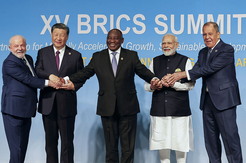 From left, Brazil's President Luiz Inacio Lula da Silva, China's President Xi Jinping, South Africa's President Cyril Ramaphosa, India's Prime Minister Narendra Modi and Russia's Foreign Minister Sergei Lavrov pose for a BRICS group photo during the 2023 BRICS Summit at the Sandton Convention Centre in Johannesburg, South Africa, Wednesday, Aug. 23, 2023