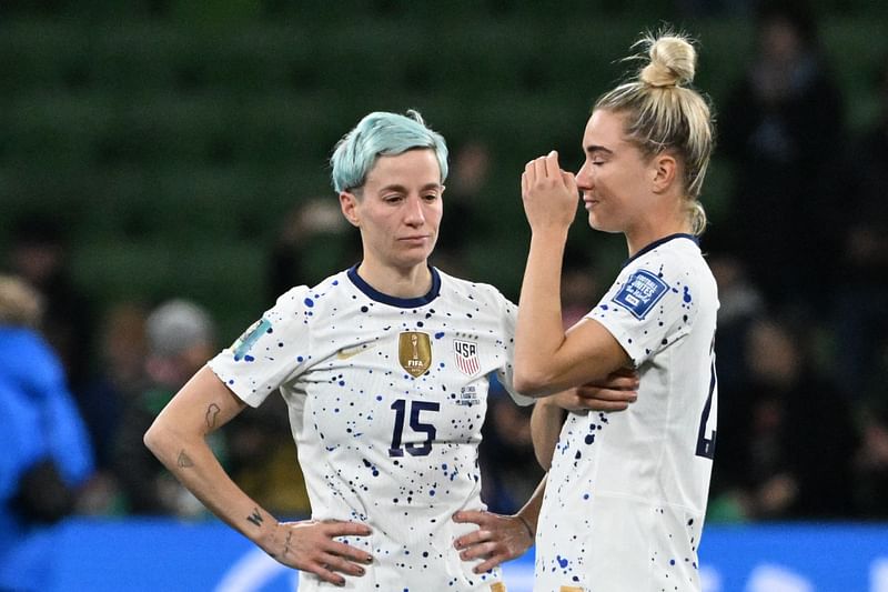 USA's forward Megan Rapinoe and USA's midfielder Kristie Mewis react at the end of the Australia and New Zealand 2023 Women's World Cup round of 16 football match between Sweden and USA at Melbourne Rectangular Stadium in Melbourne on 6 August 2023