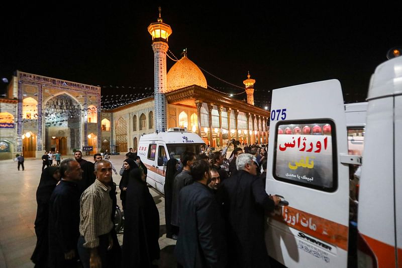 Emergency personnel transport the injured following a shooting attack at Iran's Shah Cheragh mausoleum in the Fars province capital Shiraz, on 13 August, 2023