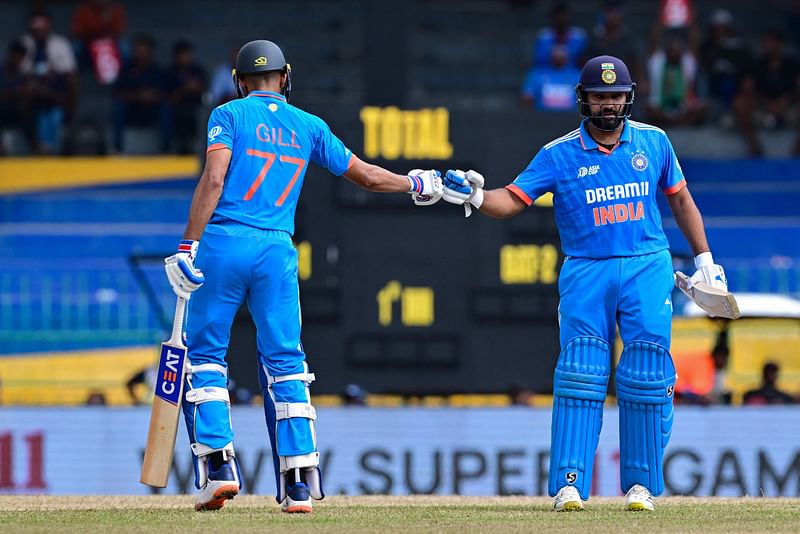 India's captain Rohit Sharma (R) and Shubman Gill bump their fists during the Asia Cup 2023 super four one-day international (ODI) cricket match between India and Pakistan at the R. Premadasa Stadium in Colombo on 10 September, 2023