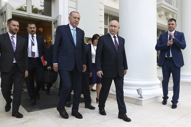 Russian President Vladimir Putin, center right, and Turkish President Recep Tayyip Erdogan, center left, walk after their talks at Russia's Black Sea resort of Sochi, Russia, Monday, Sept. 4, 2023.