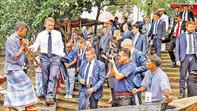 French president Emmanuel Macron gets up in a boat during a visit to Bangladesh. He takes a boat ride in the Turag river. The picture was taken from Borobazar Eco Park dock area in Mirpur on 11 September, 2023