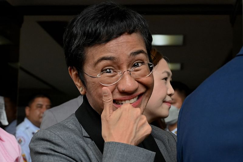 Philippine journalist and Nobel laureate Maria Ressa reacts outside the Pasig Regional Trial Court following her acquittal in a tax evasion case in Pasig, Metro Manila on 12 September, 2023