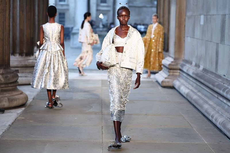 Models present creations by Erdem during a catwalk presentation for their Spring/Summer 2024 collection, at the British Museum during London Fashion Week in London, on 17 September, 2023.