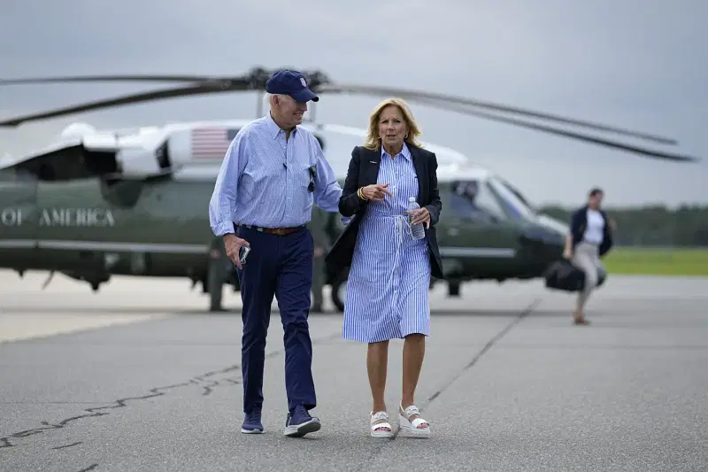 President Joe Biden and first lady Jill Biden walk to board Air Force One for departure at Gainesville Regional Airport after surveying damage caused by Hurricane Idalia, Saturday, Sept. 2, 2023, in Gainesville, Fla.