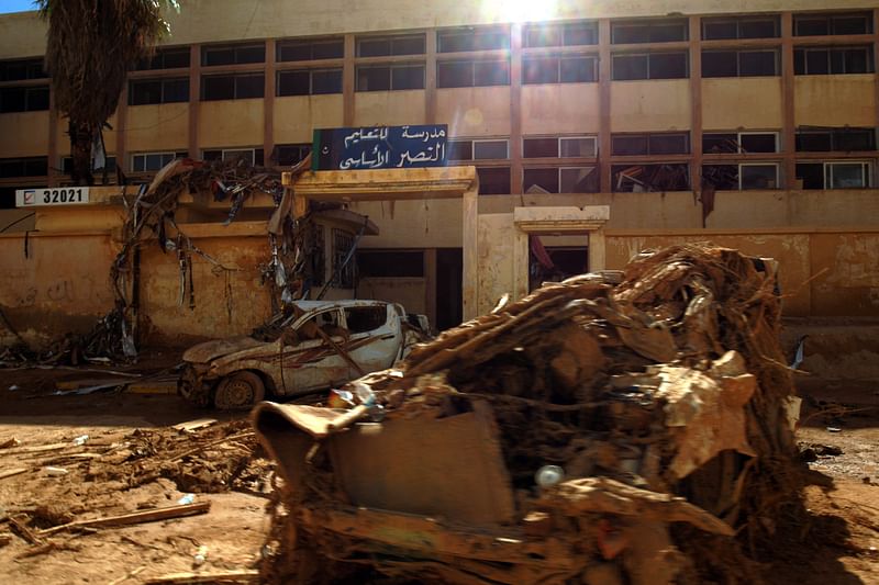 Debris block a street next to a school after the Mediterranean storm "Daniel" hit Libya's eastern city of Derna on 15 September, 2023