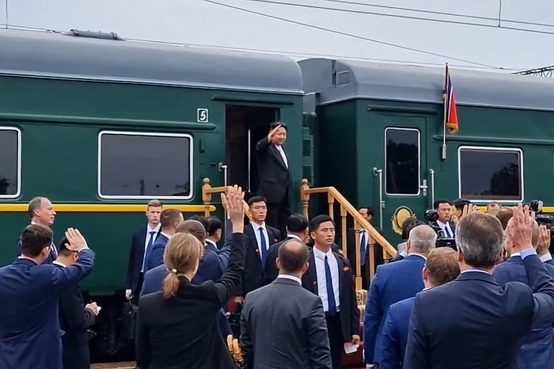 In this video grab taken from a handout footage released by the Ministry of Natural Resources and Environment of Russia on September 17, 2023, North Korea's leader Kim Jong Un (C) waves before boarding a train during a farewell ceremony at the end of his visit to Russia at the Artyom railway station near Vladivostok, in the Primorsky region