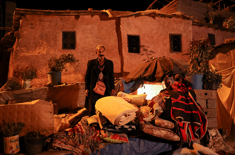 Mohamed, 66, stands near his damaged house in Moulay Brahim village, in the province of Al Haouz, following a powerful earthquake in Morocco, on 9 September, 2023.