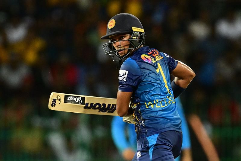 Sri Lanka's Dunith Wellalage watches the ball after he plays a shot during the Asia Cup 2023 Super 4 match between India and Sri Lanka at the R. Premadasa Stadium in Colombo on 12 September 2023