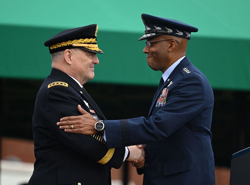 Retiring Chairman of the Joints Chiefs of Staff, Army General Mark Milley (L), greets incoming Chairman, Air Force General Charles Brown, during the Armed Forces Farewell Tribute in honor of Milley, at Joint Base Myer-Henderson Hall in Arlington, Virginia, on 29 September, 2023