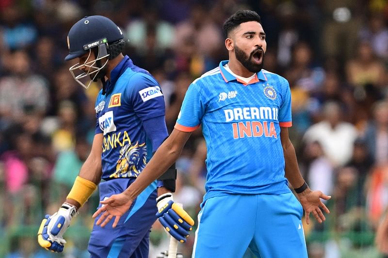 India's Mohammed Siraj celebrates after taking the wicket of Sri Lanka's captain Dasun Shanaka during the Asia Cup 2023 final between Sri Lanka and India at the R. Premadasa Stadium in Colombo on 17 September 2023