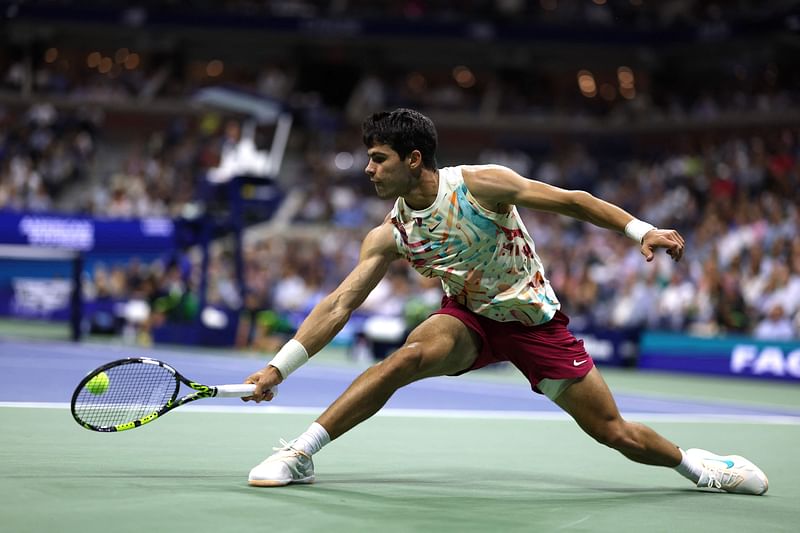 Carlos Alcaraz of Spain returns a shot against Lloyd Harris of South Africa during their Men's Singles Second Round match on Day Four of the 2023 US Open at the USTA Billie Jean King National Tennis Center at USTA Billie Jean King National Tennis Center on 31 August, 2023