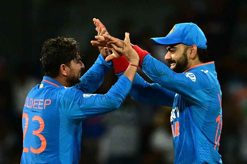 India's Kuldeep Yadav (L) and Virat Kohli celebrate their team's victory at the end of the Asia Cup 2023 super four one-day international (ODI) cricket match between India and Pakistan at the R. Premadasa Stadium in Colombo on September 11, 2023