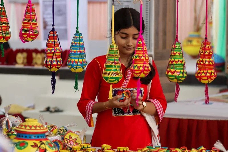 A teenage girl at the Mritshilpi Mela (earthenware fair) at Ashwini Kumar Hall in Barishal city on 20 October 2023.