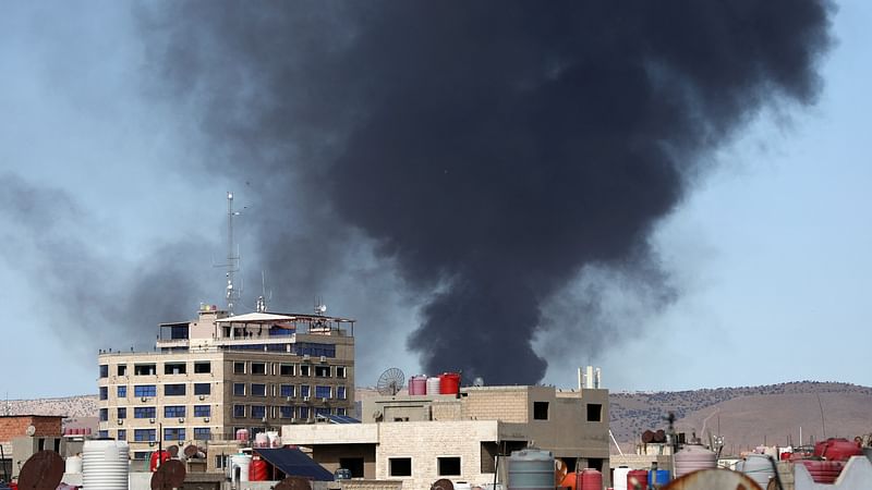 Smoke rises from Syria's Kurdish-controlled northeast city of Qamishli, Syria on 5 October, 2023