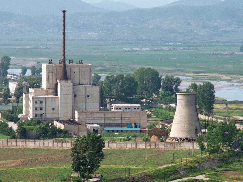 A North Korean nuclear plant is seen before demolishing a cooling tower (R) in Yongbyon, in this photo taken June 27, 2008 and released by Kyodo