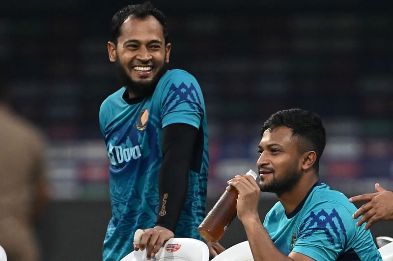 Bangladesh's captain Shakib Al Hasan (R) and Mushfiqur Rahim speak during a practice session on the eve of their 2023 ICC Men's Cricket World Cup one-day international (ODI) match against South Africa at the Wankhade Stadium in Mumbai on 23 October, 2023