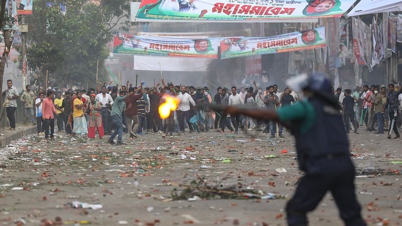 A policeman in action in Dhaka on 28 October.