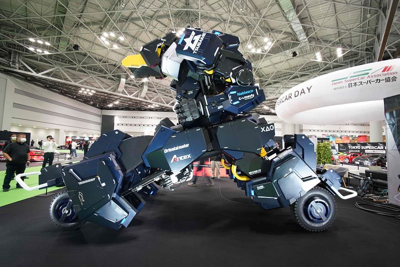 Japanese robotics startup Tsubame Industries exhibit the ARCHAX robot, weighing 3.5 tonnes and measuring 4.5 meters in height, during the press day of the Japan Mobility Show in Tokyo on 25 October, 2023