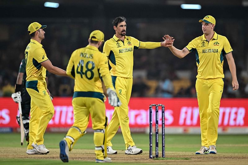 Australia's Mitchell Starc (C) celebrates with teammates after taking the wicket of Pakistan's Hasan Ali during the 2023 ICC Men's Cricket World Cup one-day international (ODI) match between Australia and Pakistan