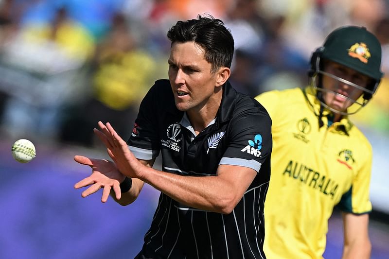 New Zealand's Trent Boult catches the ball during the 2023 ICC Men's Cricket World Cup one-day international (ODI) match between Australia and New Zealand at the Himachal Pradesh Cricket Association Stadium in Dharamsala on 28 October, 2023.