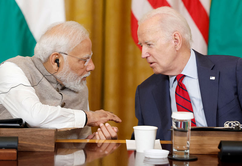 US President Joe Biden and India’s Prime Minister Narendra Modi talk during a meeting with senior officials and CEOs of American and Indian companies in the East Room of the White House in Washington, US, on 23 June, 2023