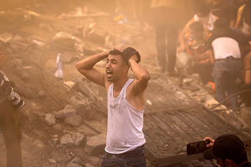 A Palestinian man looks devastated after a building in Khan Yunis was demolished by an Israeli airstrike on 6 November, 2023