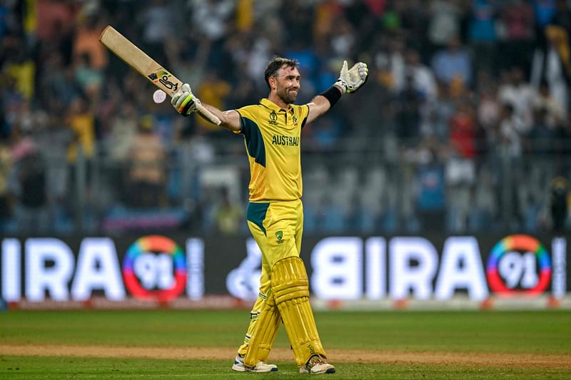 Australia's Glenn Maxwell celebrates after winning the 2023 ICC Men's Cricket World Cup one-day international (ODI) match between Australia and Afghanistan at the Wankhede Stadium in Mumbai on 7 November, 2023