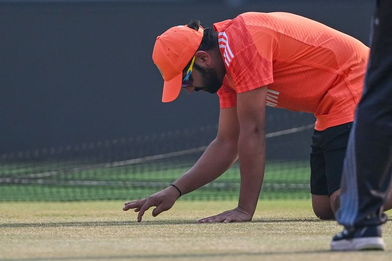 India’s captain Rohit Sharma checks the pitch during a practice session at the Narendra Modi Stadium in Ahmedabad on 17 November 2023, ahead of the 2023 ICC Men's Cricket World Cup one-day international (ODI) final match against Australia on 19 November.