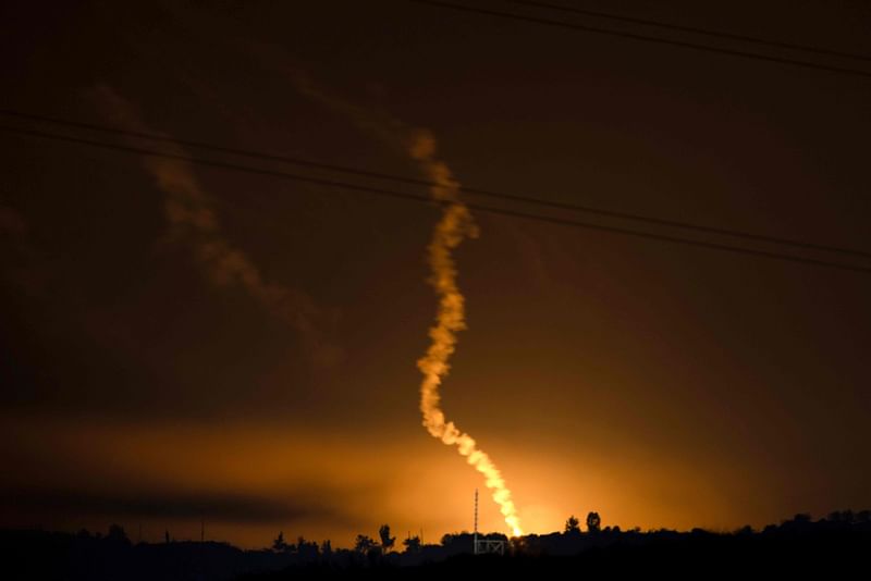 This picture taken from southern Israel shows flares launched by Israeli forces above the Gaza Strip on 17 November, 2023, amid ongoing battles between Israel and the Palestinian Hamas movement