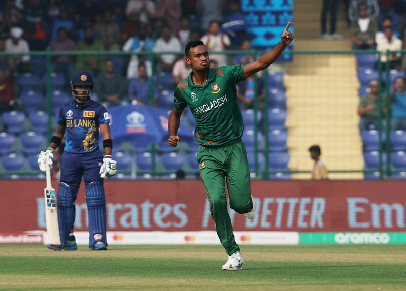 Bangladesh's Shoriful Islam celebrates after taking the wicket of Sri Lanka's Kusal Perera