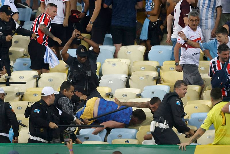 Fans of Argentina clash with Brazilian police before the start of the 2026 FIFA World Cup South American qualification football match between Brazil and Argentina at Maracana Stadium in Rio de Janeiro, Brazil, on 21 November, 2023.