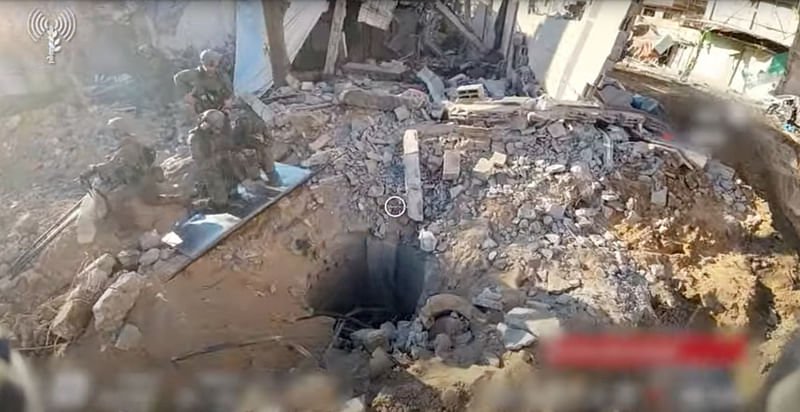 An opening to a tunnel that, according to Israel's military, was used by Palestinian militants under Al Shifa hospital in the Gaza Strip as seen in this screen grab taken from a handout video released by the Israel Defense Forces on November 19, 2023, amid the ongoing conflict between Israel and the Palestinian Islamist group Hamas