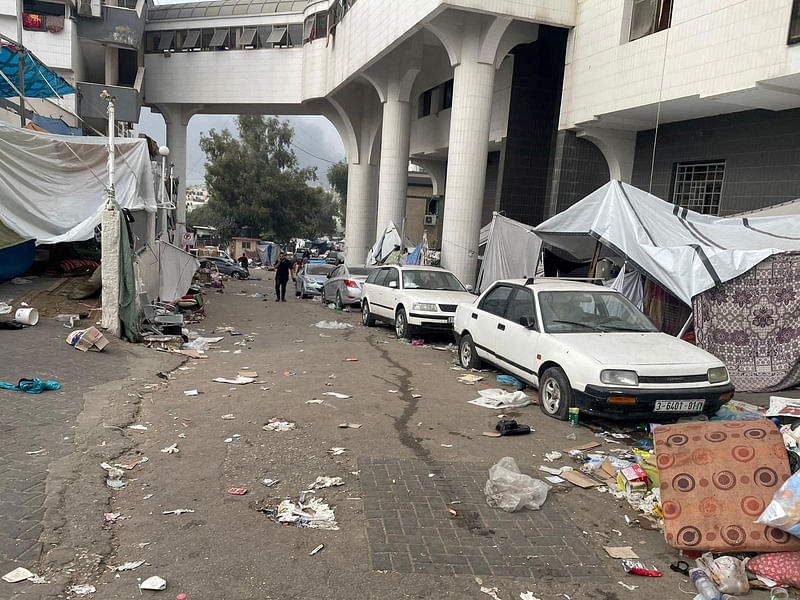 A man walks within the premises of Al Shifa hospital during the Israeli ground operation around the hospital, in Gaza City November 12, 2023