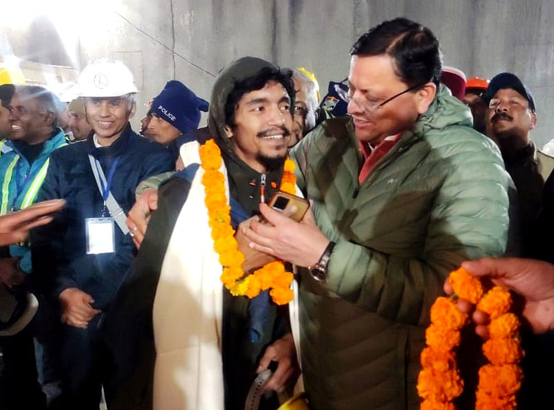 Uttarakhand CM Pushkar Singh Dhami meets the workers who were trapped inside the Silkyara tunnel after the rescue operation, in Uttarkashi on 28 November, 2023