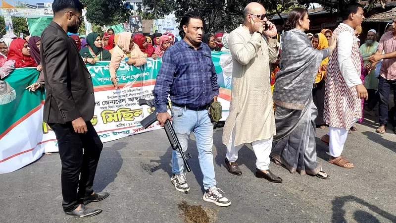 A man publicly carries a firearm in a demonstration procession of Awami League at Notun Bazar area in Mymensingh on Sunday afternoon.