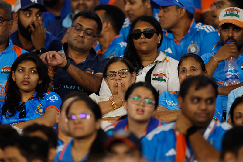 India fans look dejected in the stands