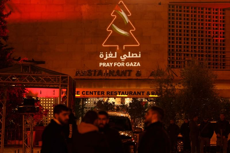 A message in support of Gaza is displayed on a building next to the square of the Church of the Nativity in the biblical city of Bethlehem in the occupied West Bank on December 24, 2023, ahead of midnight mass