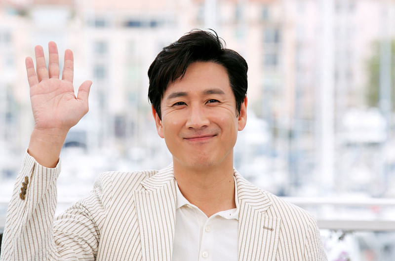 72nd Cannes Film Festival - Photocall for the film 'Parasite' (Gisaengchung) in competition - Cannes, France, 22 May, 2019. Cast member Lee Sun-kyun poses.