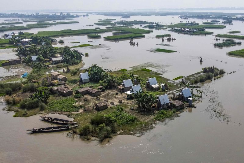 This aerial photograph taken on September 3, 2023 shows the mobile modular shelters "Khudi Bari" or 'tiny houses' surrounded by floodwaters in Char Shildaha