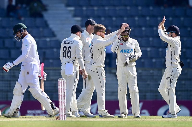 New Zealand’s cricketers celebrate after the dismissal of Bangladesh’s Nurul Hasan (L) during the fourth day of the first Test cricket match between Bangladesh and New Zealand at the Sylhet International Cricket Stadium in Sylhet on 1 December, 2023