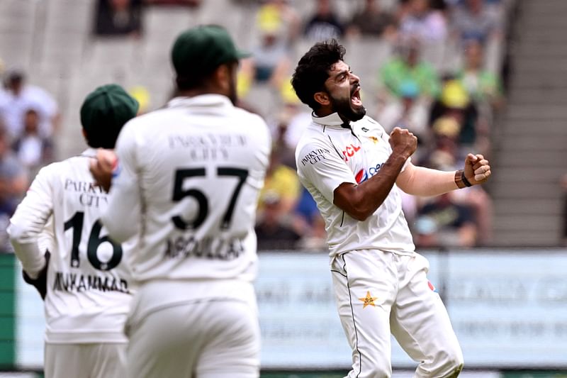 Pakistan’s bowler Aamer Jamal (R) celebrates dismissing Australia’s batsman Marnus Labuschagne on the second day of the second cricket Test match between Australia and Pakistan at the Melbourne Cricket Ground (MCG) in Melbourne on 27 December, 2023