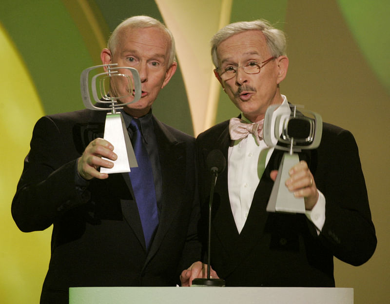 Comedians and brothers, Tom (L) and Dick Smothers, star of the television series ‘The Smothers Brothers Comedy Show’ accept the Favorite Singing Siblings award at the 3rd annual TV Land Awards in Santa Monica, California on 13 March in 2005