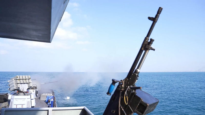 An Israeli military vessel fires at sea in a location given as Gaza, amid the ongoing conflict between Israel and the Palestinian Islamist group Hamas, in this still image obtained from a handout video released December 3, 2023